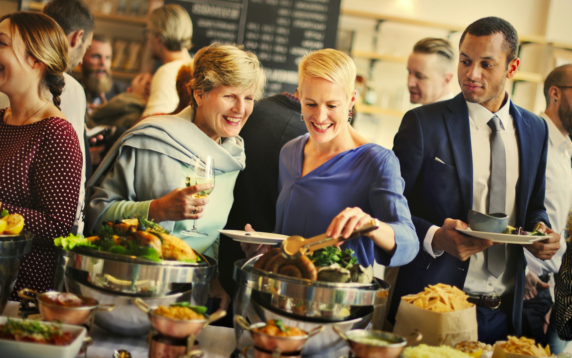 Group of diverse people are having lunch together