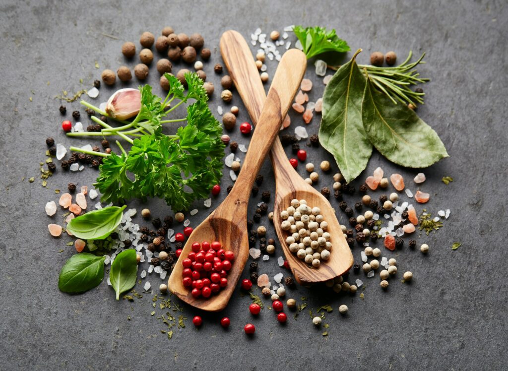 Spices and herbs on black board