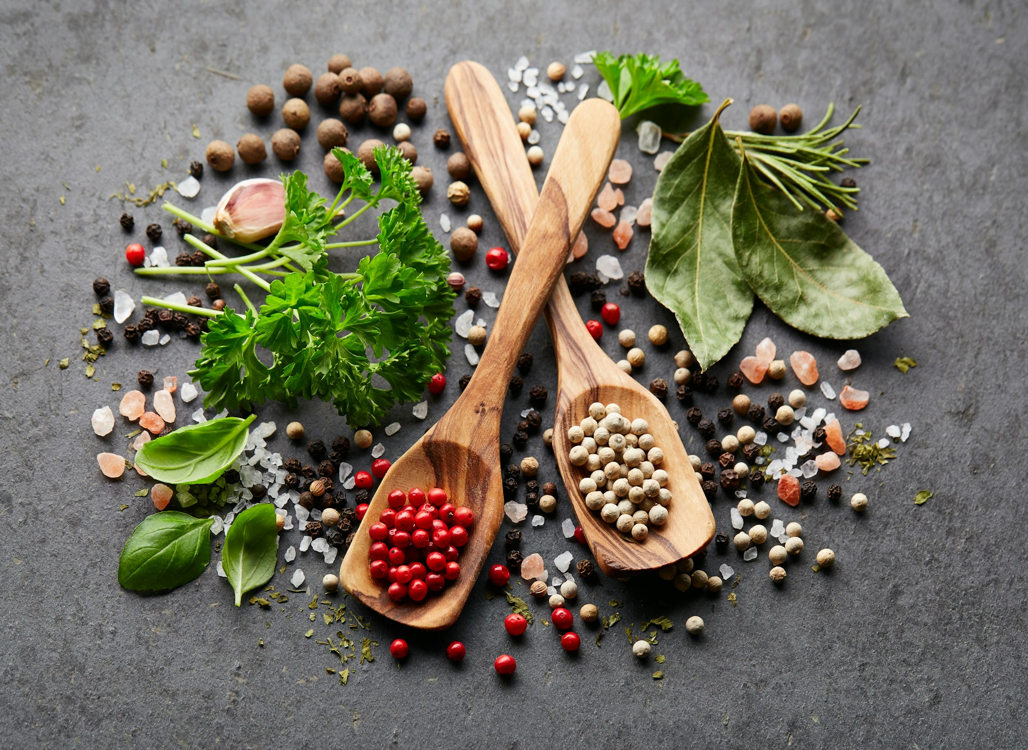 Spices and herbs on black board