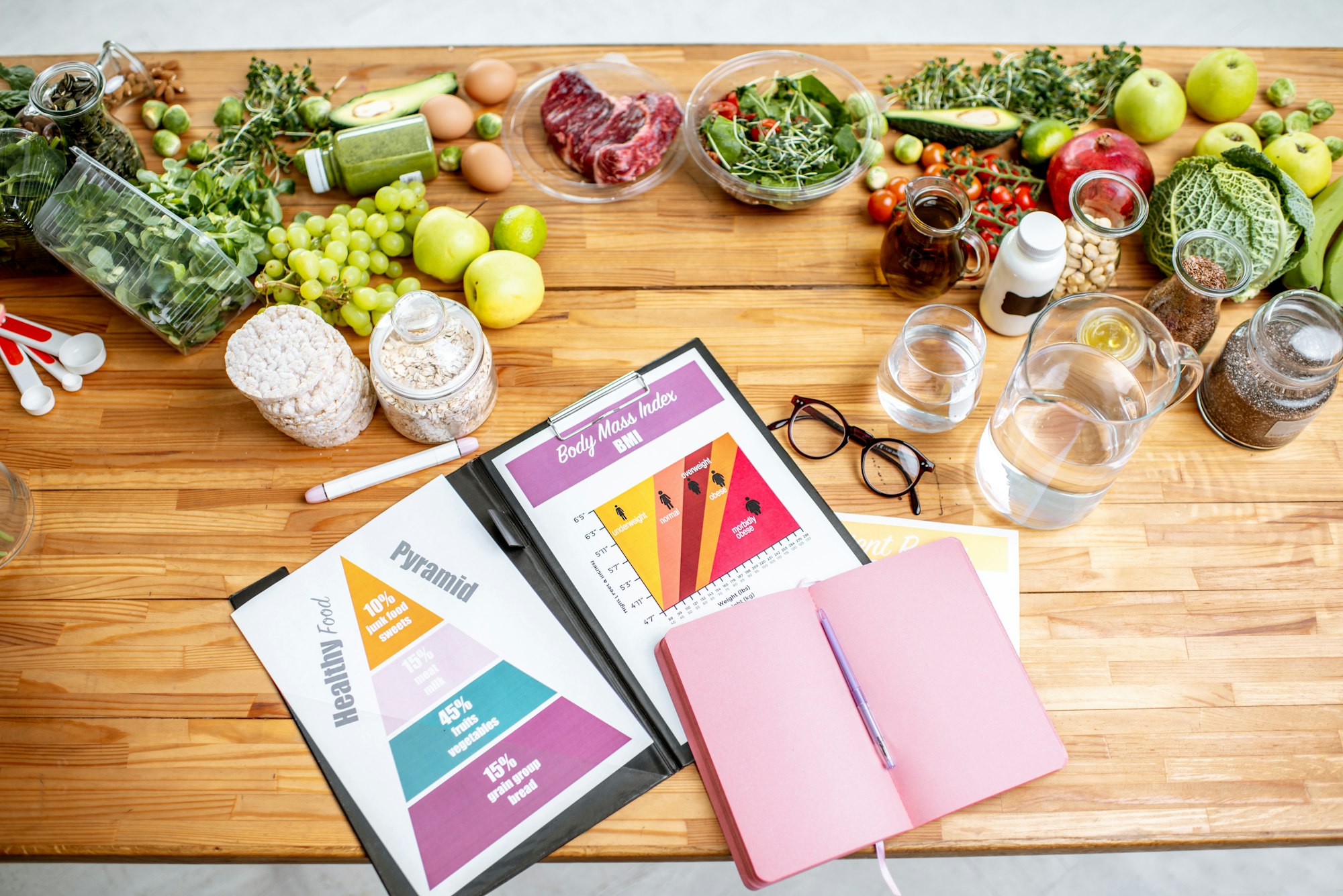 Nutritionists working place with food and documents